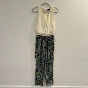 Woman’s Jumpsuit cream sleeveless top, paisley bottom in blues and mustard
